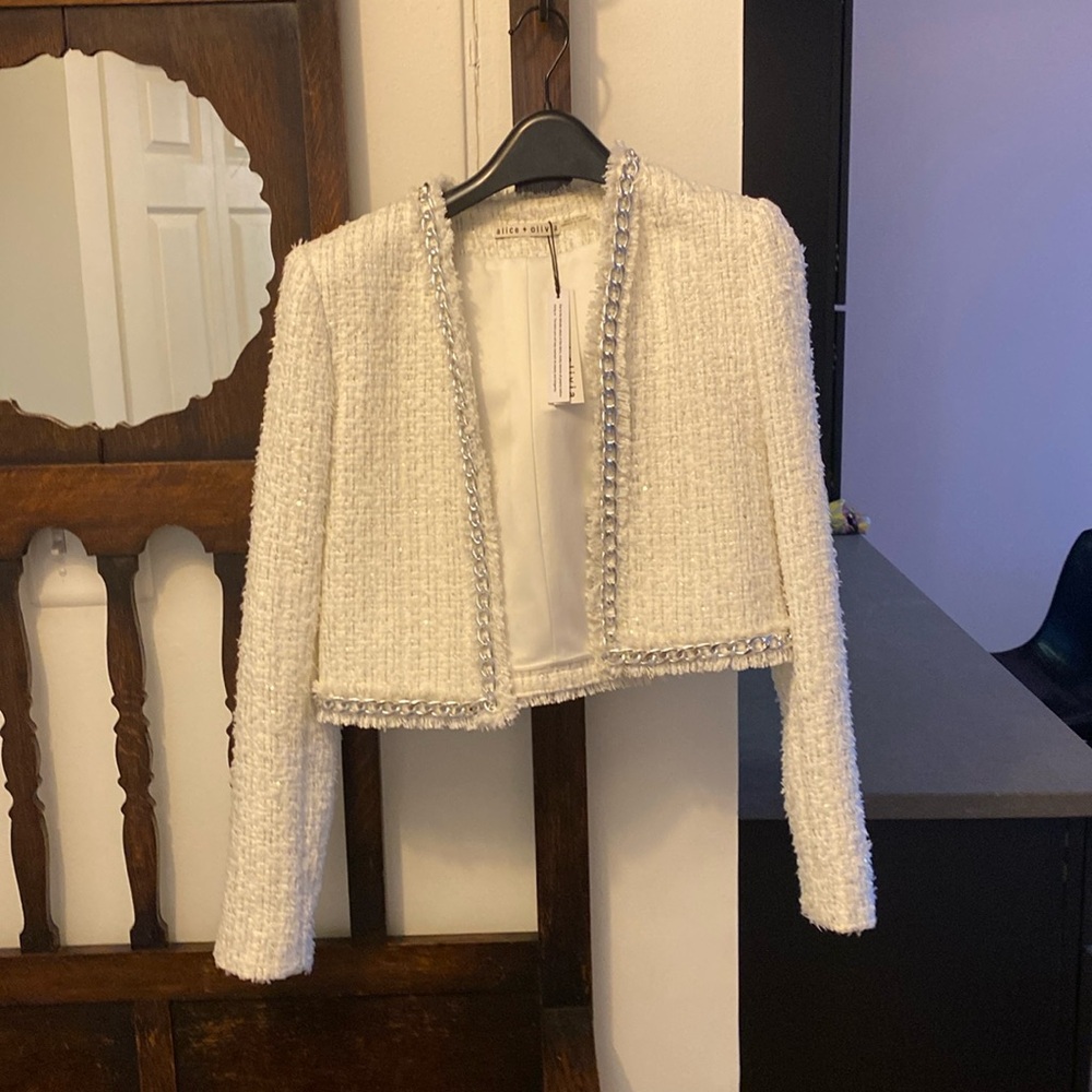 Fantastic Chanel style blazer with metal chain trim.